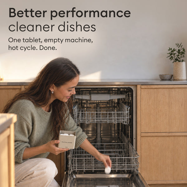 Dishwasher Cleaner Starter Set: woman placing a tablet in the empty dishwasher before a hot cycle