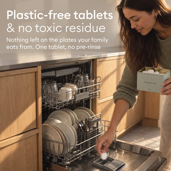 Dishwasher Detergent Starter Set: woman loading a tablet into the dishwasher, plastic-free tablets with no pre-rinse
