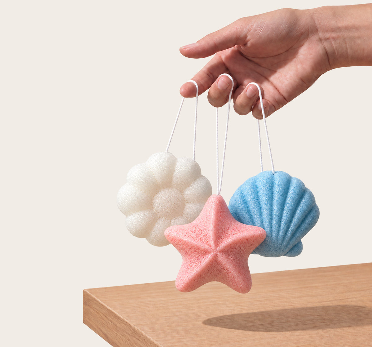 Baby Konjac Sponges: how it works, the sponge hanging by its cotton string