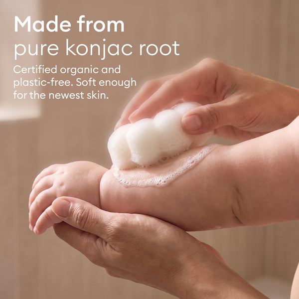 Baby Konjac Sponges: parent washing a baby's foot with the flower sponge, made from pure konjac root