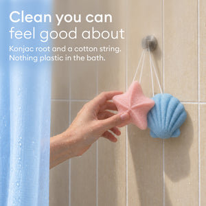 Baby Konjac Sponges: starfish and shell sponges hanging from a shower hook by their cotton strings