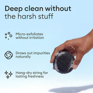 Konjac Face Sponges: hand holding the charcoal sponge, micro-exfoliates and draws out impurities