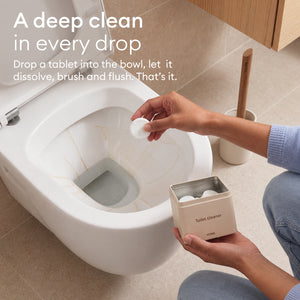 The Tablet Detox: hand dropping a tablet into the toilet bowl, let it dissolve, then brush and flush