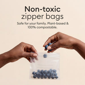 Compostable Zip Bag Set: hand pouring blueberries into a bag, non-toxic and fully compostable